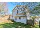 A rear view of the property reveals a backyard with a partially fenced yard ready for customization at 4821 Mainstreet Valley Trce, Stone Mountain, GA 30088