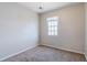 Bedroom with neutral paint, carpet floors, and a window at 4821 Mainstreet Valley Trce, Stone Mountain, GA 30088