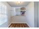 Dining room featuring hardwood floors, a window, and access to the living room at 4821 Mainstreet Valley Trce, Stone Mountain, GA 30088