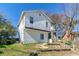 Two-story home featuring white siding, front stairs, and an unfinished front yard at 4821 Mainstreet Valley Trce, Stone Mountain, GA 30088