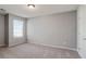 Bedroom with neutral carpet, a window, and gray paint at 5446 Waterfall Ct, Atlanta, GA 30349