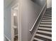 Stairway leading to the powder room at 5446 Waterfall Ct, Atlanta, GA 30349