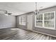 Spacious living room with modern flooring, ceiling fan, and abundant natural light at 5446 Waterfall Ct, Atlanta, GA 30349