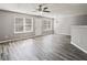 Bright and spacious living room featuring wood floors and multiple windows with natural light at 5446 Waterfall Ct, Atlanta, GA 30349