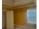 Bedroom featuring a large window, ceiling fan and a closet door at 9996 Village South Dr, Douglasville, GA 30135