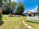 Large backyard with a shed and stone pathway at 101 Talking Leaves Ct, Acworth, GA 30101