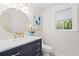 Elegant bathroom with a marble countertop, stylish faucet, and decorative mirror at 3371 Liberty Lane, Marietta, GA 30062