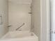 Close up of tub and shower in a bathroom with grab bars and shelves at 3420 Lineview Dr, Ellenwood, GA 30294
