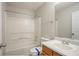 Clean bathroom features a tub and shower combination, updated vanity, and white ceramic toilet at 3420 Lineview Dr, Ellenwood, GA 30294