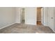 Neutral bedroom featuring carpet and two doors: one to closet, one to exit at 3420 Lineview Dr, Ellenwood, GA 30294