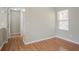 Cozy bedroom showcasing wood floors, a bright window, and neutral paint at 3420 Lineview Dr, Ellenwood, GA 30294