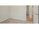 Neutral bedroom features plush carpeting, light-colored walls and trim, and closet access at 3420 Lineview Dr, Ellenwood, GA 30294