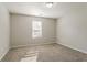 Comfortable bedroom with carpet, neutral paint, and a bright window at 3420 Lineview Dr, Ellenwood, GA 30294