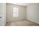Neutral bedroom features plush carpeting, a bright window, and ample natural light at 3420 Lineview Dr, Ellenwood, GA 30294