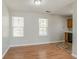 Bright dining area with hardwood floors, natural light, and convenient kitchen access at 3420 Lineview Dr, Ellenwood, GA 30294