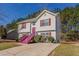 Side view of a charming two-story home with landscaped yard and a cozy, inviting atmosphere at 3420 Lineview Dr, Ellenwood, GA 30294