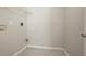 Utility room offers connections for a washer and dryer, shelf, and concrete flooring at 3420 Lineview Dr, Ellenwood, GA 30294