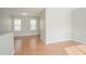 Bright living area featuring hardwood floors and ample natural light streaming through multiple windows at 3420 Lineview Dr, Ellenwood, GA 30294
