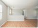 Spacious living room featuring wood floors, neutral paint, and ample natural light at 3420 Lineview Dr, Ellenwood, GA 30294