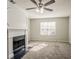 Bright living room with a decorative fireplace and a ceiling fan for added comfort at 3420 Lineview Dr, Ellenwood, GA 30294