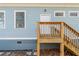 Charming home exterior with blue siding, white trim, and a wooden porch at 1057 Regent Sw St, Atlanta, GA 30310