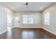 Open concept living room featuring hardwood floors, modern ceiling fan, and neutral paint at 1057 Regent Sw St, Atlanta, GA 30310