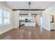 Open concept living room showcasing view to the modern kitchen with white cabinets at 1057 Regent Sw St, Atlanta, GA 30310