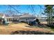 View of the backyard with a large playground and a carport at 2150 Fincher Rd, Canton, GA 30114