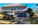 View of a driveway leading to a grey garage in the back of the home at 2150 Fincher Rd, Canton, GA 30114