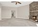 Cozy living room with plush carpeting and a striking stone fireplace as its focal point at 2150 Fincher Rd, Canton, GA 30114