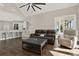 Open concept living room featuring a bar, modern furniture, and large windows for natural light at 2150 Fincher Rd, Canton, GA 30114