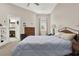 Relaxing main bedroom with neutral walls, plush carpeting, and a view into the attached bathroom at 2150 Fincher Rd, Canton, GA 30114