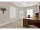 Cozy home office with a classic wooden desk, bright windows, and ample natural light at 2150 Fincher Rd, Canton, GA 30114