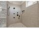 Modern shower with glass block accent, gray tiling, built-in niche, and rainfall shower head at 2150 Fincher Rd, Canton, GA 30114