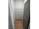 Walk-in closet featuring wire shelving for efficient storage, and a gray door at 3037 Abelia Dr, Buford, GA 30519