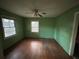 Bright bedroom with hardwood floors, two windows, and a classic ceiling fan at 3195 Benjamin E Mays Sw Dr, Atlanta, GA 30311