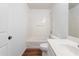 Bathroom featuring a tub with shower and modern single sink vanity at 418 Lantern Wood Dr, Scottdale, GA 30079