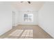 Bright bedroom with neutral carpet, a ceiling fan, and a window with natural light at 418 Lantern Wood Dr, Scottdale, GA 30079