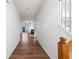 Hallway featuring wood floor and a view of the living room at 418 Lantern Wood Dr, Scottdale, GA 30079