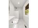 Bright, modern bathroom with rainfall shower and view of wooded landscape at 150 Melody Ln, Fayetteville, GA 30215