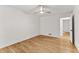Minimal bedroom with hardwood floors and a ceiling fan at 150 Melody Ln, Fayetteville, GA 30215