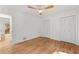 Spacious bedroom features hardwood floors, a ceiling fan and double closets for ample storage at 150 Melody Ln, Fayetteville, GA 30215