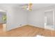 Bright bedroom with hardwood floors, ceiling fan, and en-suite bathroom at 150 Melody Ln, Fayetteville, GA 30215