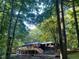 Exterior view of the home nestled within a wooded lot at 150 Melody Ln, Fayetteville, GA 30215