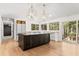 Modern kitchen featuring an island, pendant lighting, and stainless steel appliances at 150 Melody Ln, Fayetteville, GA 30215