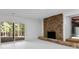 Living room with a stone fireplace and sliding glass doors leading to a porch at 150 Melody Ln, Fayetteville, GA 30215