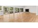 Bright living room with hardwood floors, fireplace, and large windows at 150 Melody Ln, Fayetteville, GA 30215