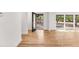 Bright living room with black framed door leading to the outside and hardwood floors at 150 Melody Ln, Fayetteville, GA 30215