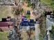 Overhead view of property featuring backyard deck, mature trees, and proximity to other homes at 1938 Kelvin Dr, Lawrenceville, GA 30043