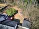 A view of the backyard featuring a shed, fencing, trees, and a multi-tiered deck at 1938 Kelvin Dr, Lawrenceville, GA 30043